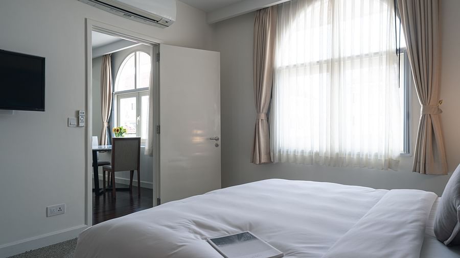 A view from the bed next to a large window of the other room | One-bedroom Suite | Central Mansions, Phnom Penh