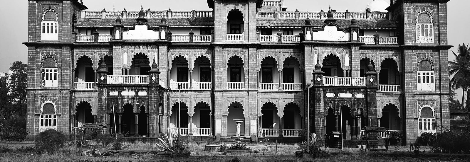 Facade of a historical building in black and white, showcasing intricate architecture