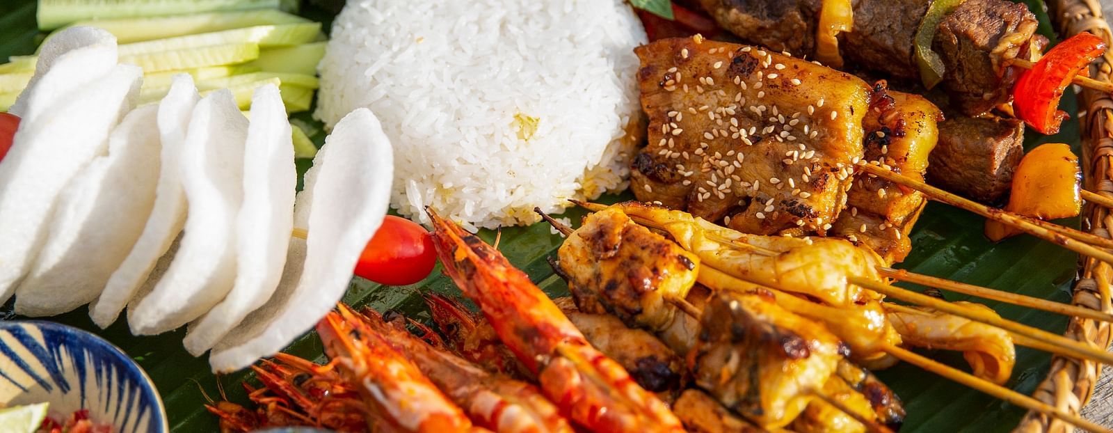 An image of a platter with different kinds of food, involving meat and other vegetables - Alibu Resort Nha Thrang