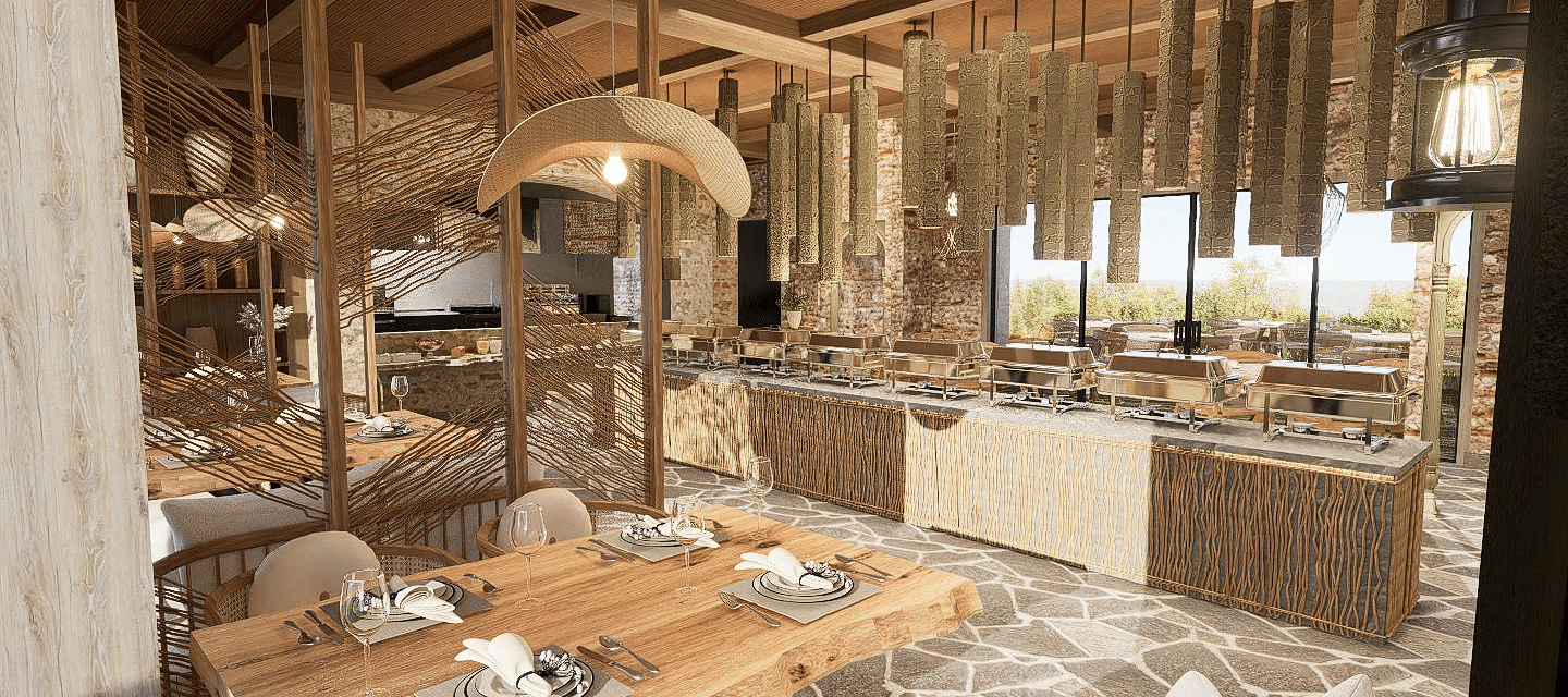 Diagonal view of the restaurant with neatly set tables and chairs, featuring a central table with a buffet setup at The Evren, Vagator.