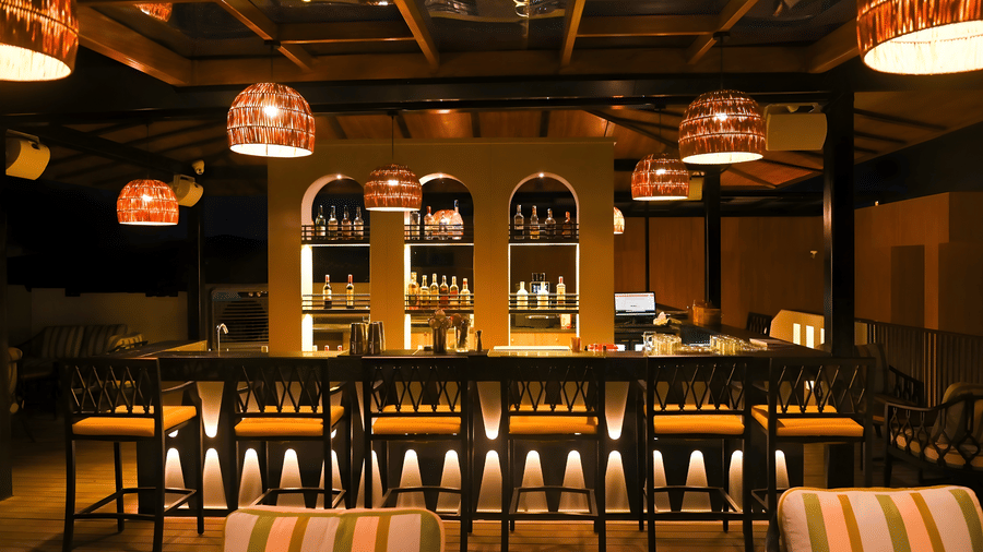 Elegant indoor restaurant at Aloha On The Ganges, Rishikesh, featuring warm lighting, stylish seating, and a welcoming ambiance for guests.