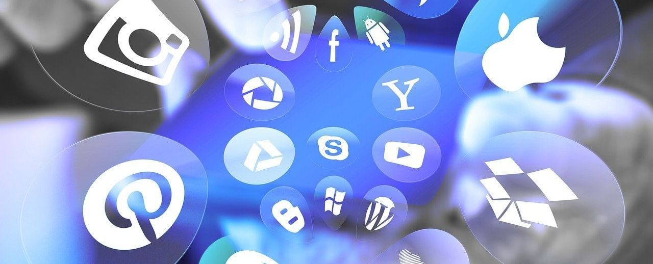 Various social media and app icons floating in a digital space, including Instagram, YouTube, Facebook, Pinterest, Skype, and others, against a blue and blurred background.