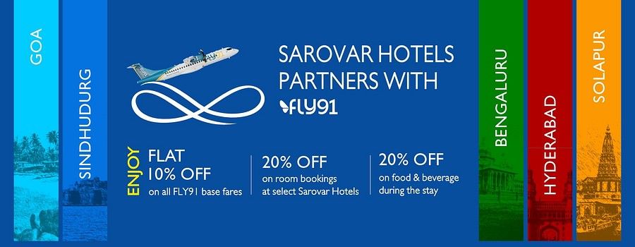 Promotional banner for Sarovar Hotels’ partnership with FLY91, offering 10% off on FLY91 base fares, 20% off on room bookings at select Sarovar Hotels, and 20% off on food and beverages.