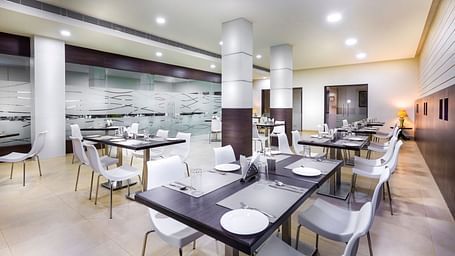 An image of a dining of Amudham Restaurant at Regency Tiruttani by GRT Hotels.