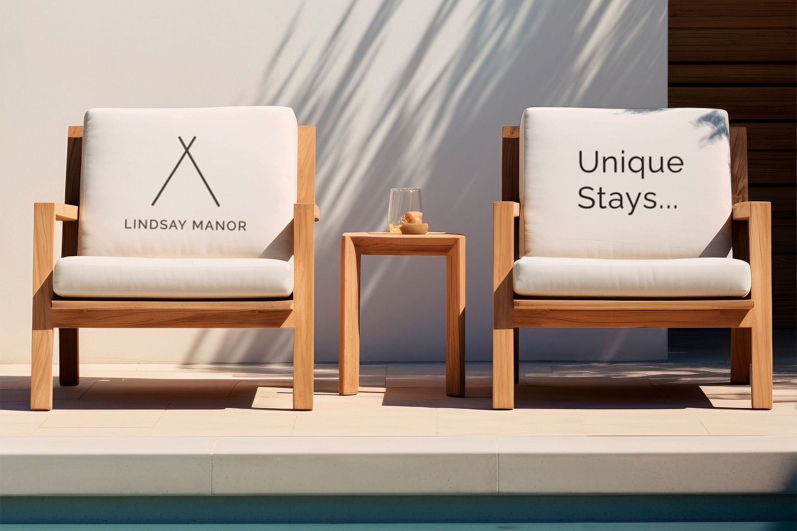 An image of two chairs next to each other, one has Lindsay Manor logo on the cushion, the other has unique stays written on it - Lindsay Manor, Vagator