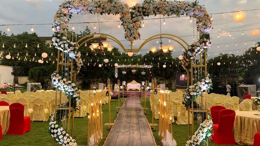 Elegant wedding entrance with heart-shaped floral arch and glowing lights at Ilara Hotels & Spa, OMR, Chennai