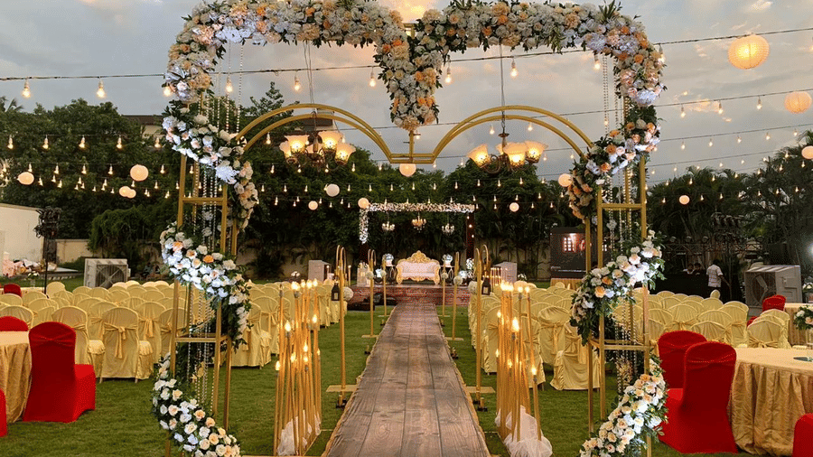 Elegant wedding entrance with heart-shaped floral arch and glowing lights at Ilara Hotels & Spa, OMR, Chennai