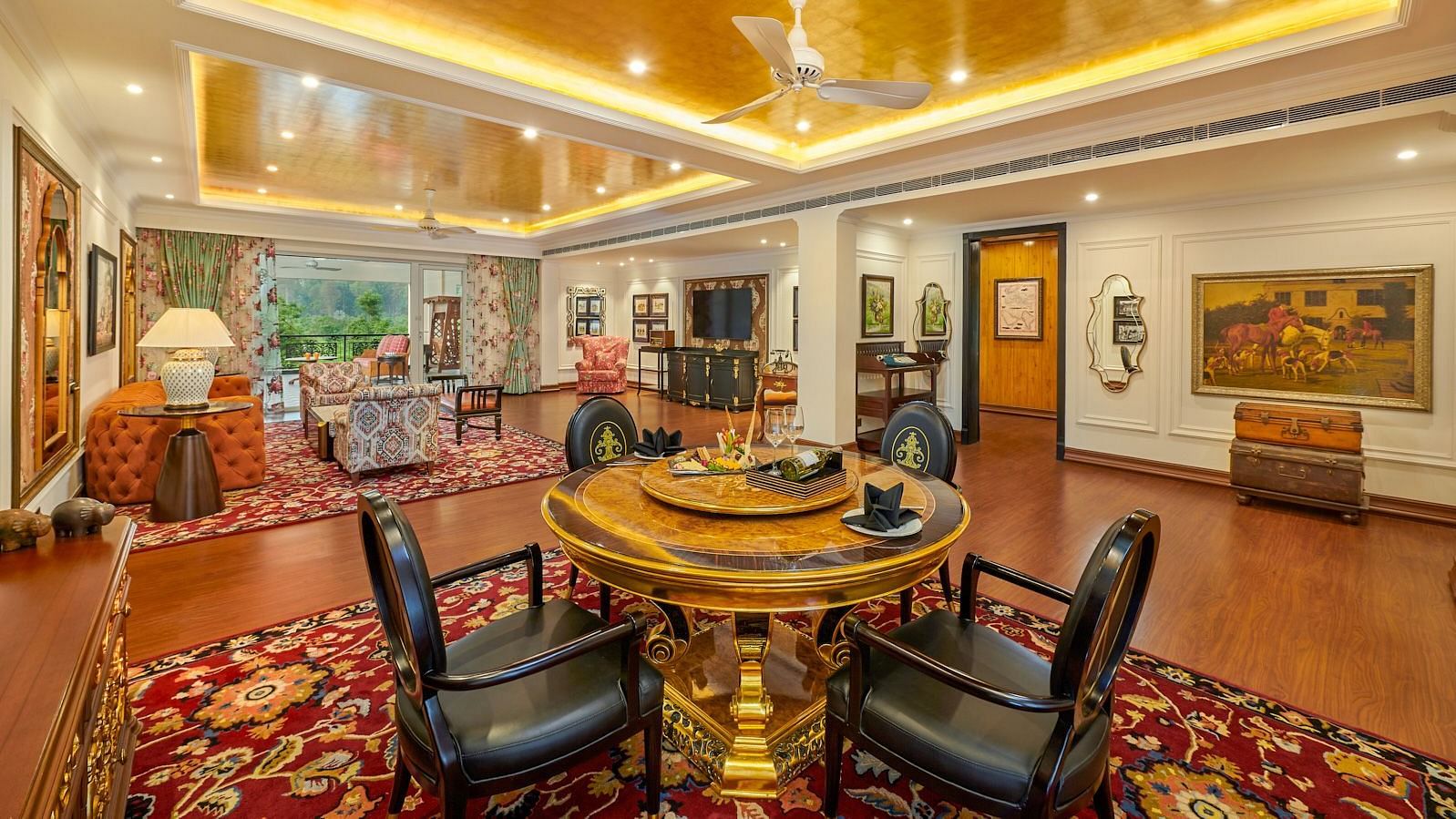 Well-lit room with dining and seating area in regal interiors at MAYFAIR Tea Resort, Siliguri