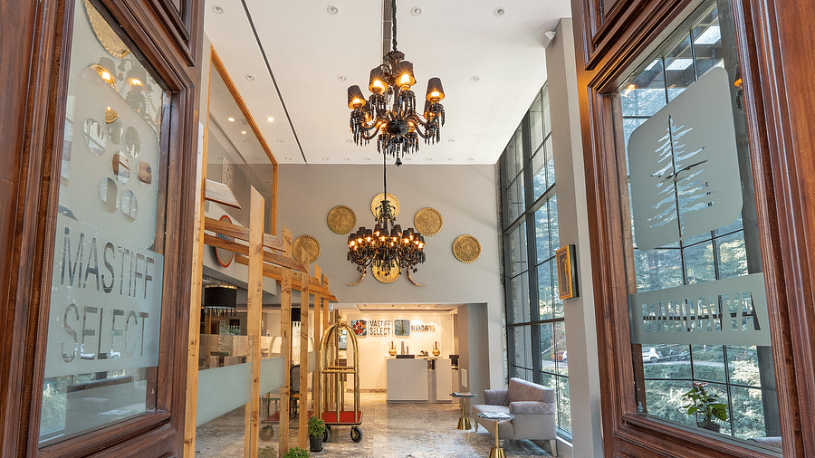 an image of entrance of Mastiff Select Mandavya Dharamkot, McLeodganj with antique chandeliers hanging from the ceiling