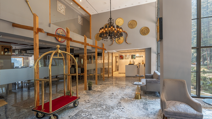 an image of a luggage cart in lobby area at Mastiff Select Mandavya Dharamkot, McLeodganj