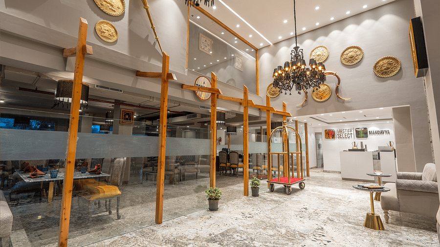 an image of a lobby space with antique chandeliers hanging from the ceiling atMastiff Select Mandavya Dharamkot, McLeodganj