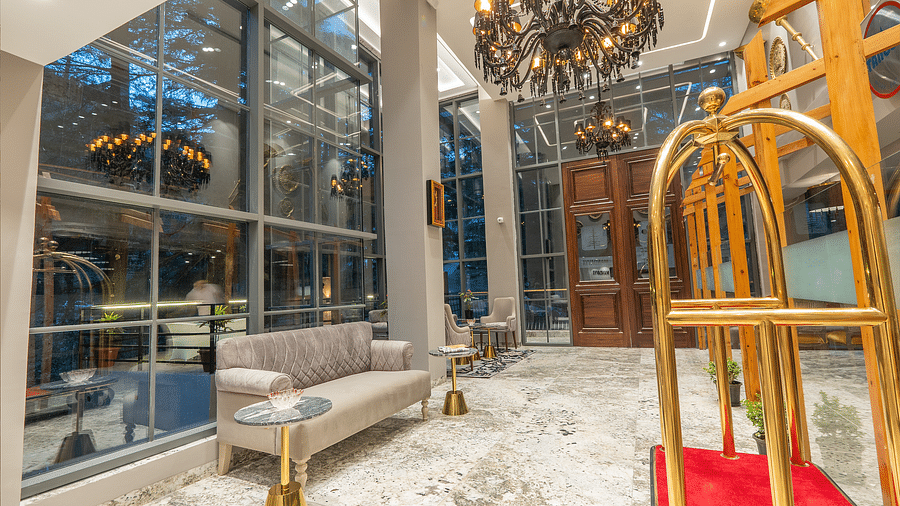 an image side view of a luggage cart in the lobby area at Mastiff Select Mandavya Dharamkot, McLeodganj