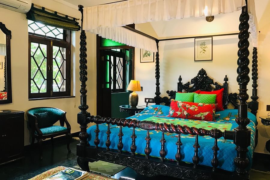 Vintage bedroom with a four-poster bed and colorful decor