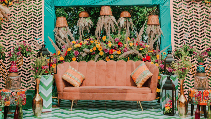 Decorated wedding stage at Marasa Sarovar Premiere, Bodhgaya featuring patterned flooring, floral backdrop, overhead decor, and central seating