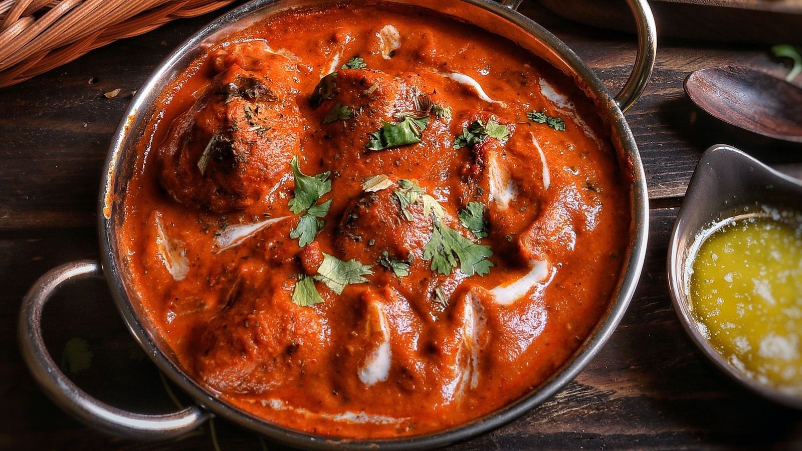 A mughlai delicacy served alongside some flatbread