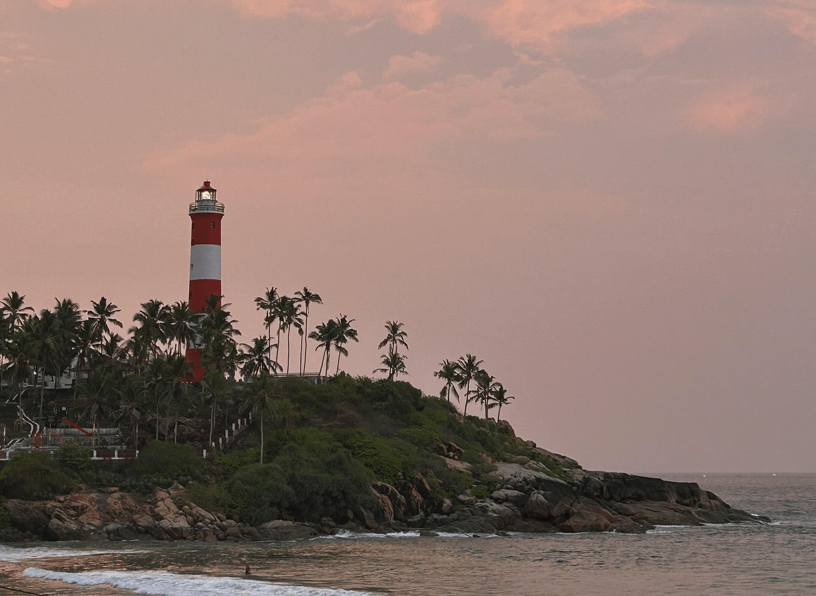 An image of a lighthouse near a beach