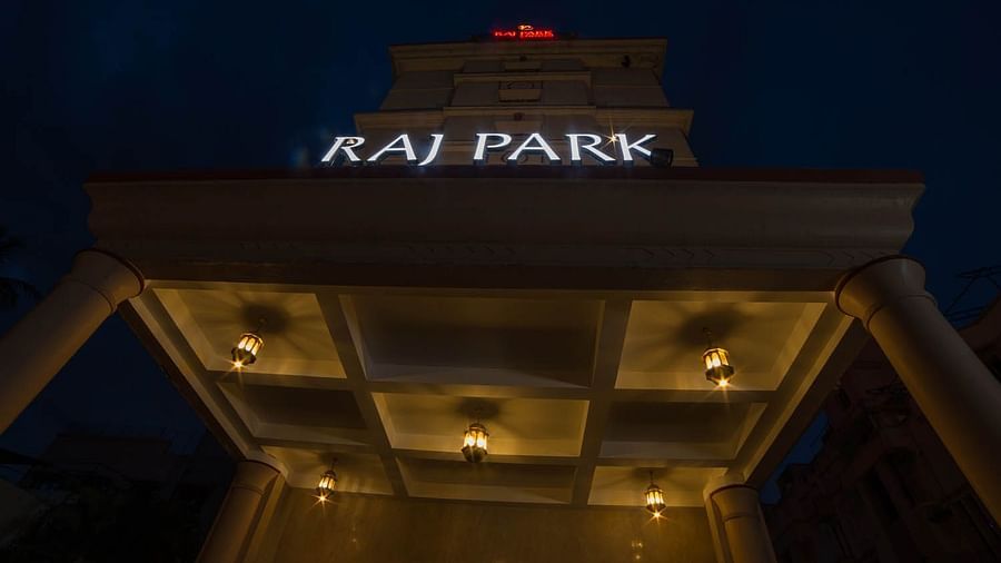facade view with the signage of Raj Park as seen from below of the Raj Park building at night