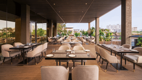 A view of dining area at Citron Bar with comfortable seating at Essentia Premiere, Pune.