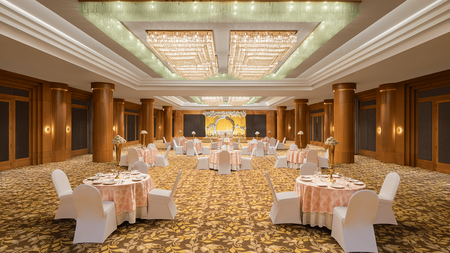 Seating arrangement in Orchid 2 under warm lighting and on patterned floor at Essentia Luxury Hotel, one of the most sought-after hotels for wedding in Indore