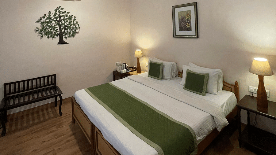 Double bed at Deluxe Double with pretty stickers on the walls and roofs at Suryaa Villa Jaipur