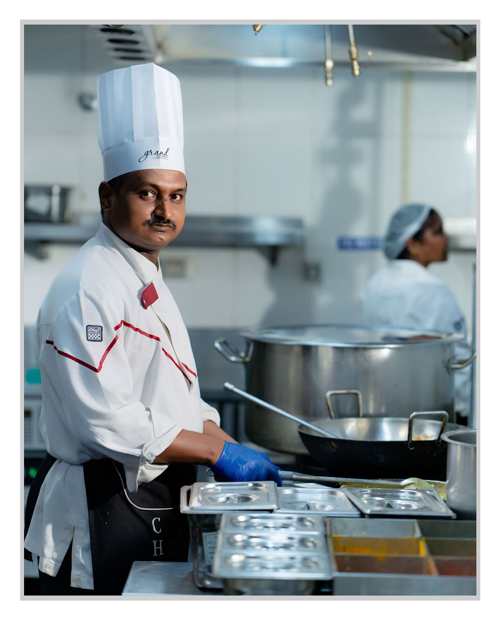 A photo of Shaik Hussain Valli preparing a meal.