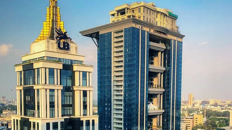 The upscale façade of UB City with luxury retail stores and elegant architectural detailing.