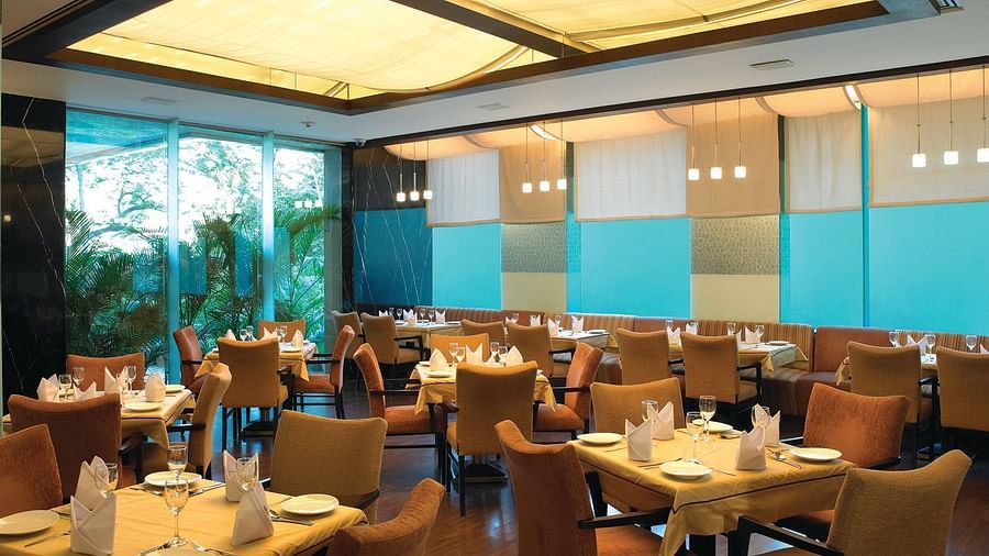 Shot of magnolia, our multi-cuisine restaurant with several seating arrangements | Mirage Hotel