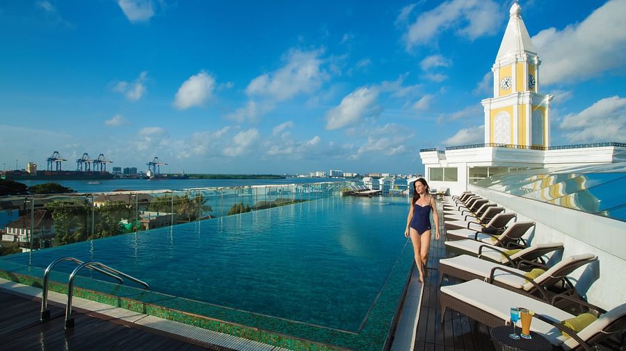 Swimming pool with a view aligning the sky and beach.