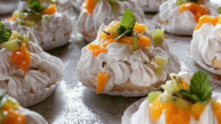A delicious dish platted on the plate and garnished with carrots and a mint leaf- Arcadia Heritage Resort, Darjeeling