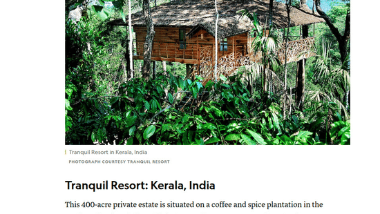 A National Geographic article highlighting a rustic elevated treehouse surrounded by thick forest greenery at Tranquil Resort, Wayanad.