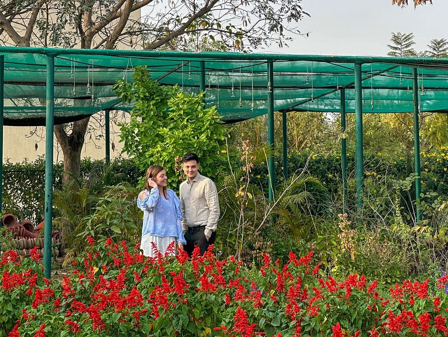 Guests enjoying a walk through a scenic flower garden.