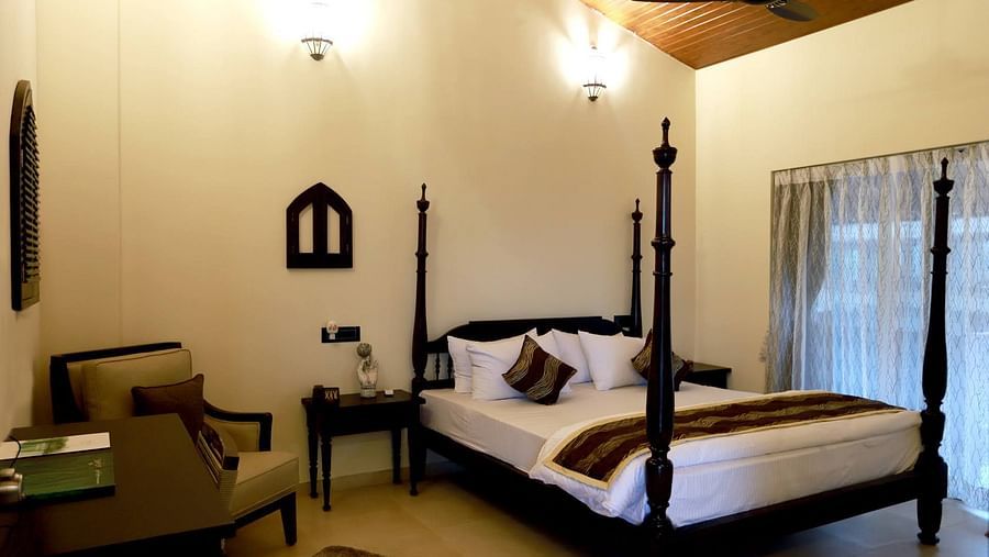 bedroom with ceiling fan, chair and cupboard - Mastiff Grand La Villae Resort, Lonavala