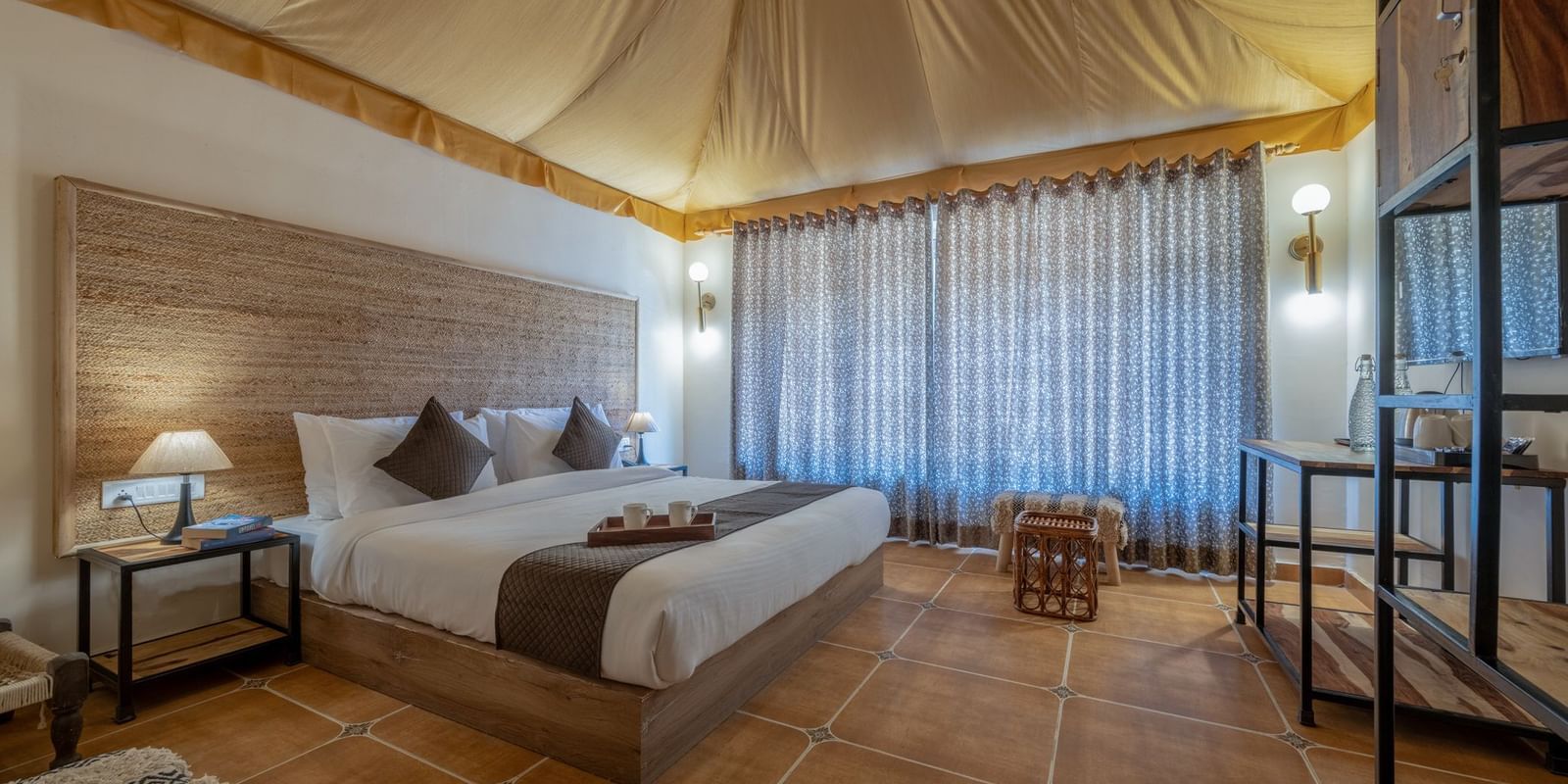 Side view of an accommodation with a bed and a tented ceiling at Valley by Grassfield.
