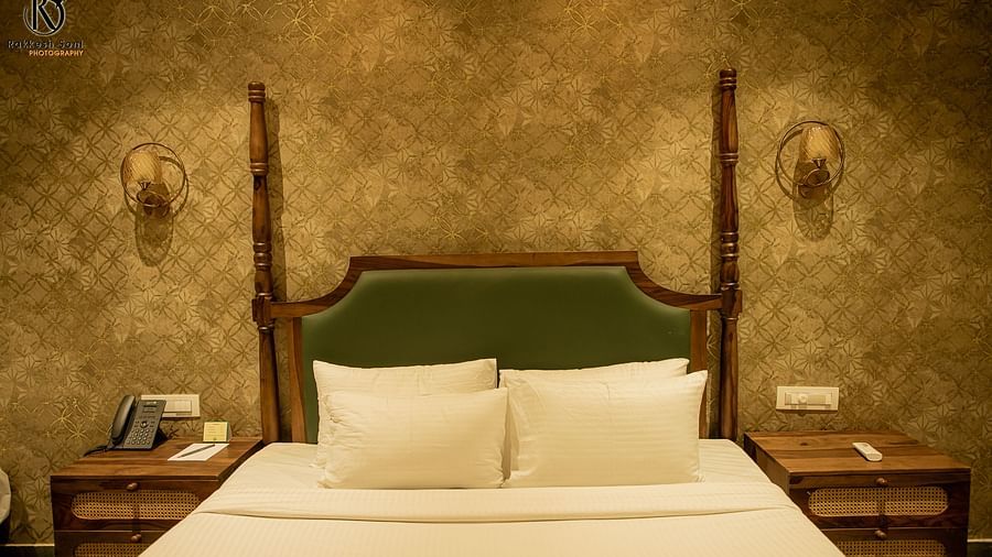 An image of the Tamara room with a king size bed, bed side tables, with decorative lighting, and minimal decoration - Trance Veecika Resort