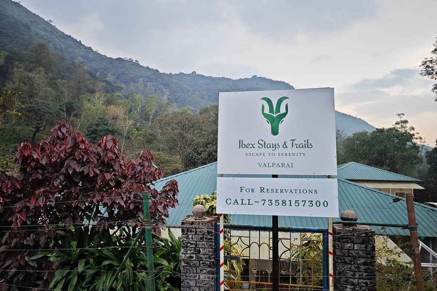 an image of Signange board of Ibex Stays & Trails, Valparai (Mistly) with the contact number - Ibex Stays & Trails, Valparai (Mistly)