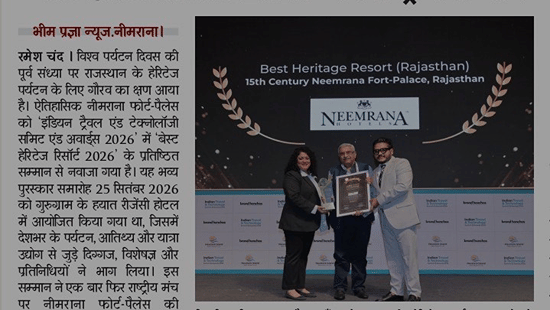 A media article in the Hindi newspaper Bheem Pragya titled 'Best Heritage Resort 2026' featuring representatives of Neemrana Fort-Palace receiving an award on stage for Best Heritage Resort 2026.