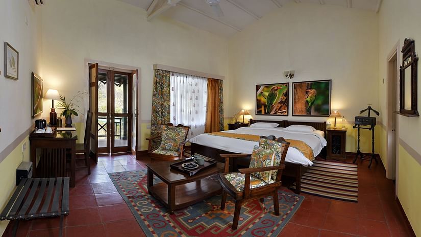Barbet room comprising of a bed, coffee table and chairs 