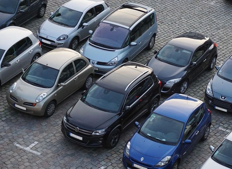 Cars parked closely together in a parking lot