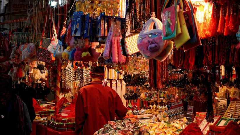 Bustling market with colourful stalls and diverse local goods.