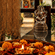 Flowers offered to a god's idol with a diya infront of it. | Hotel Devnadi, Haridwara