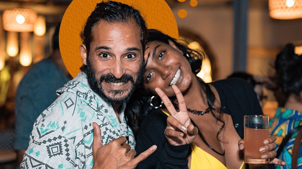 Image featuring two people posing for a picture