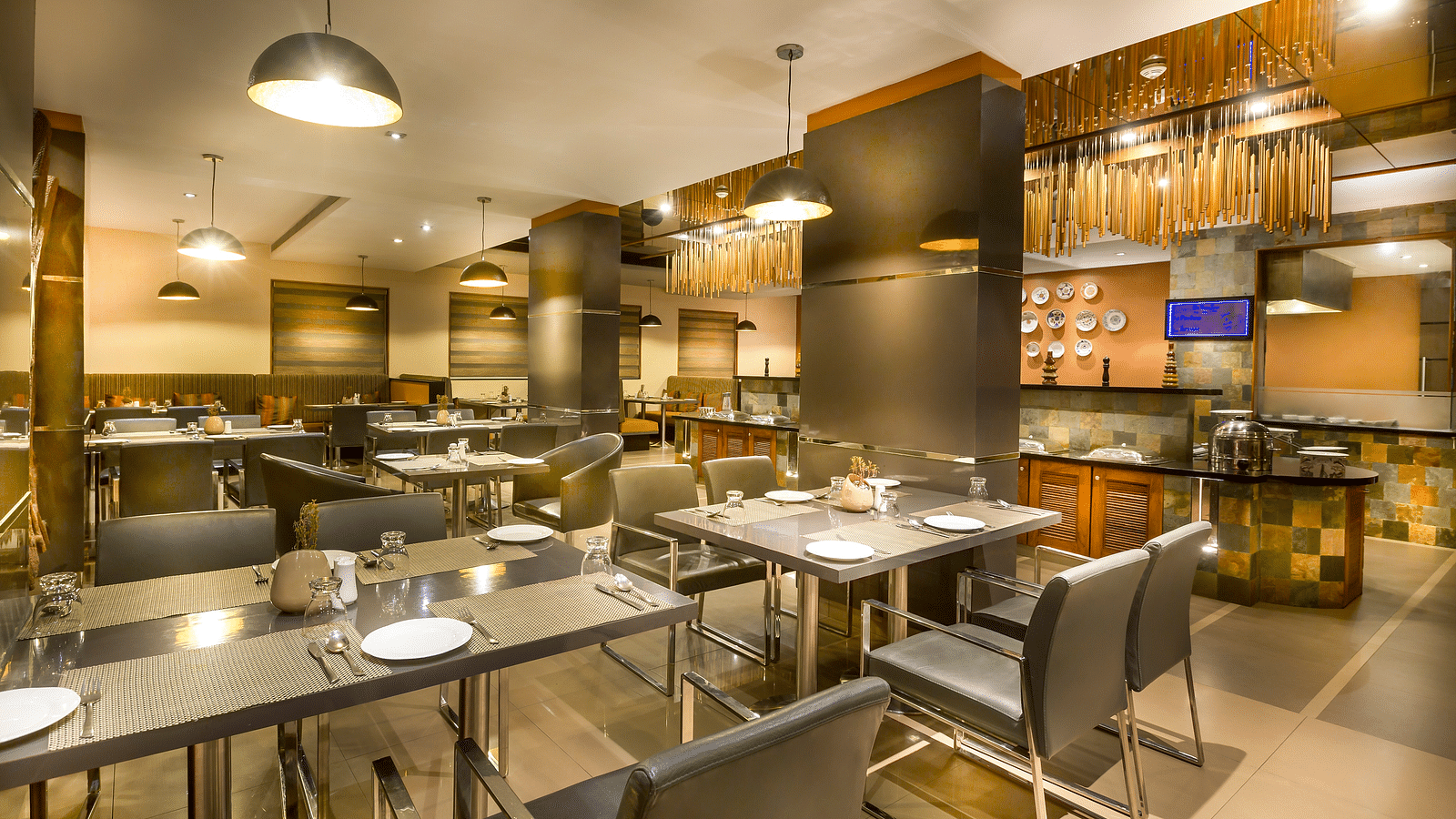  Modern restaurant interior with dark wood accents, leather chairs, and ambient lighting.