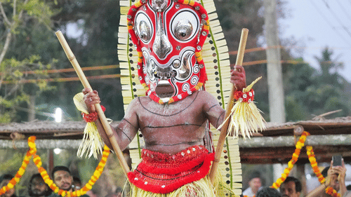 a man wearing costume performing a folk dance