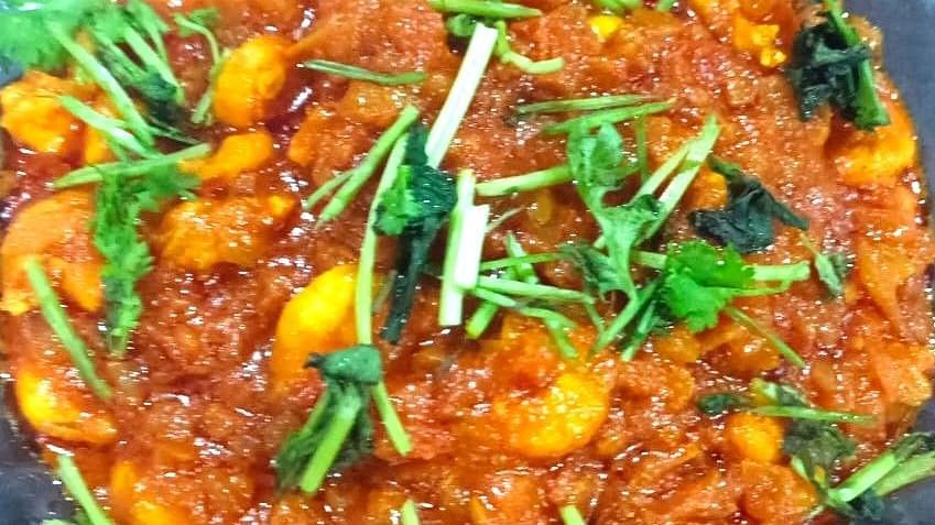 Image of prawn thokku placed in a bowl and garnished with coriander at Villa Serenity Le Sejour, Pondicherry.
