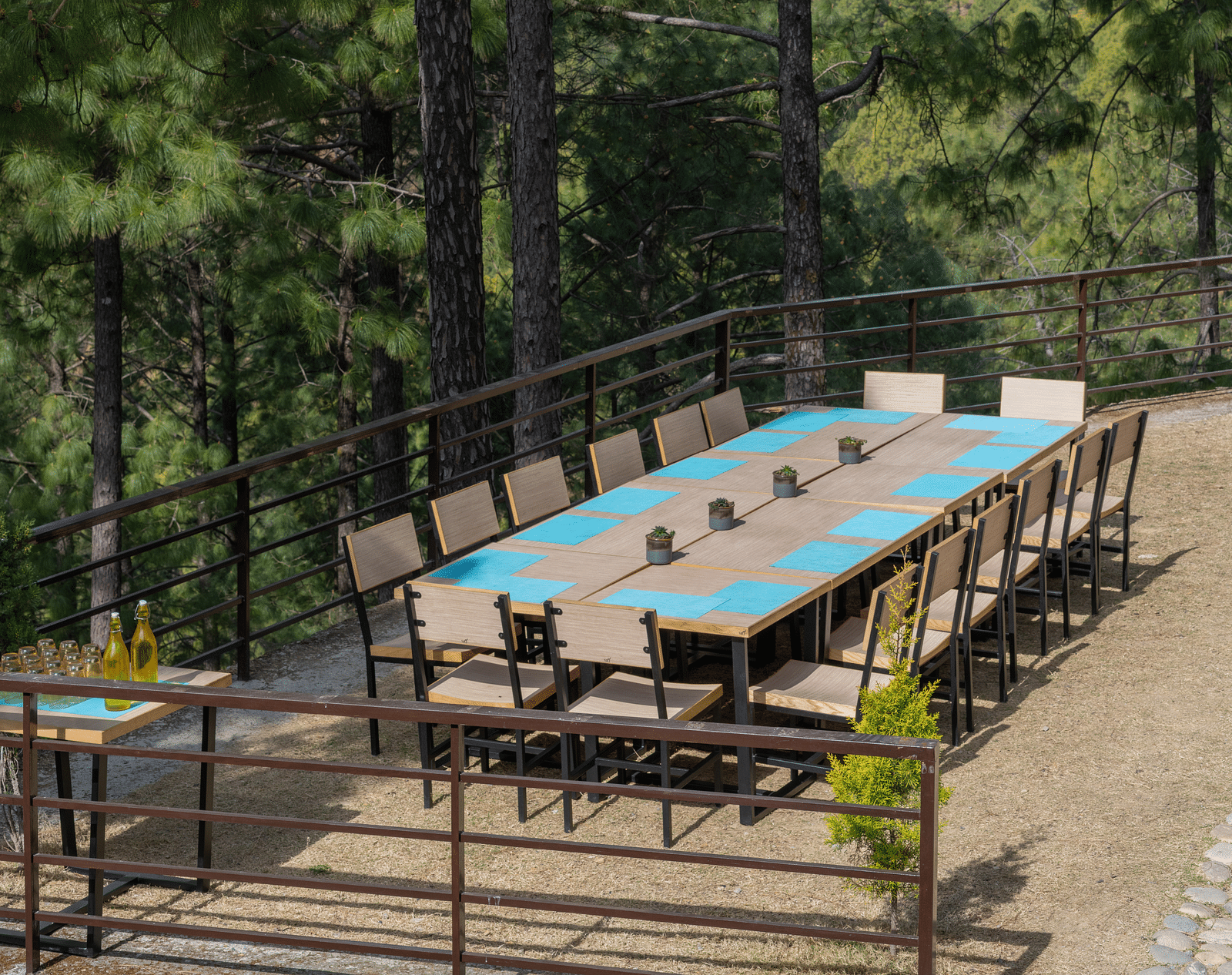 Lawn with neatly arranged chairs and a long table set up for an event at BluSalzz Escapade Resort, Lansdowne