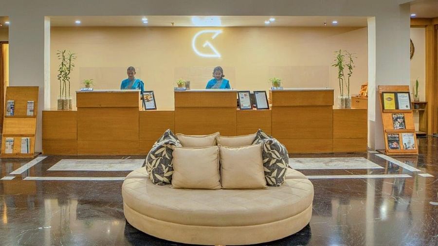 Reception lobby with seating and front desk at Golden Tulip, Udaipur.