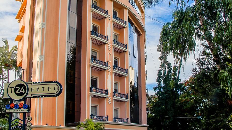Shot of the facade of the hotel with clear sky in the background  | T24 Retro