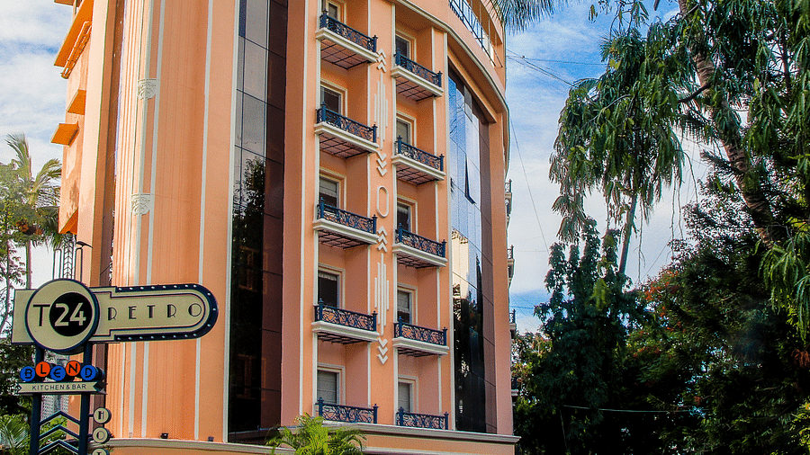 Shot of the facade of the hotel with clear sky in the background  | T24 Retro