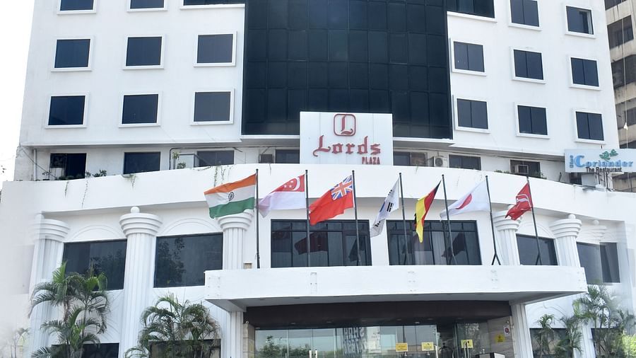 A multi-story building with signage marks the exterior of Lords Plaza Surat.