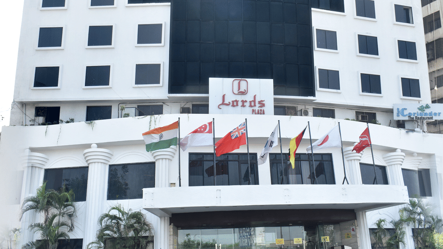 Facade of Lords Plaza Surat featuring its parking space and entrance